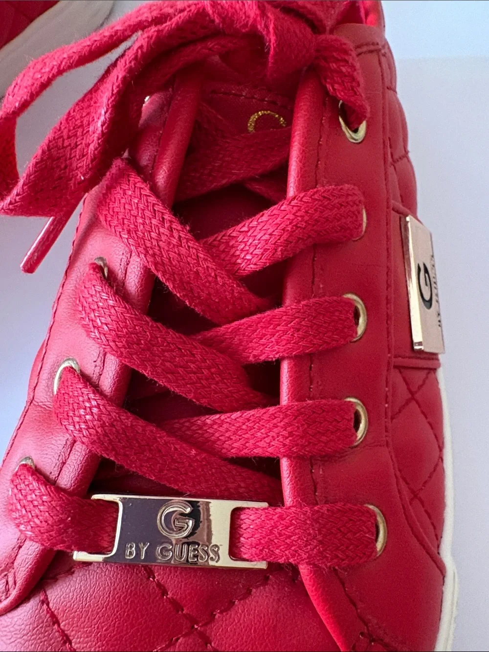 GUESS size 7.5 red quilted leather Sneakers with Gold Hardware very good shape